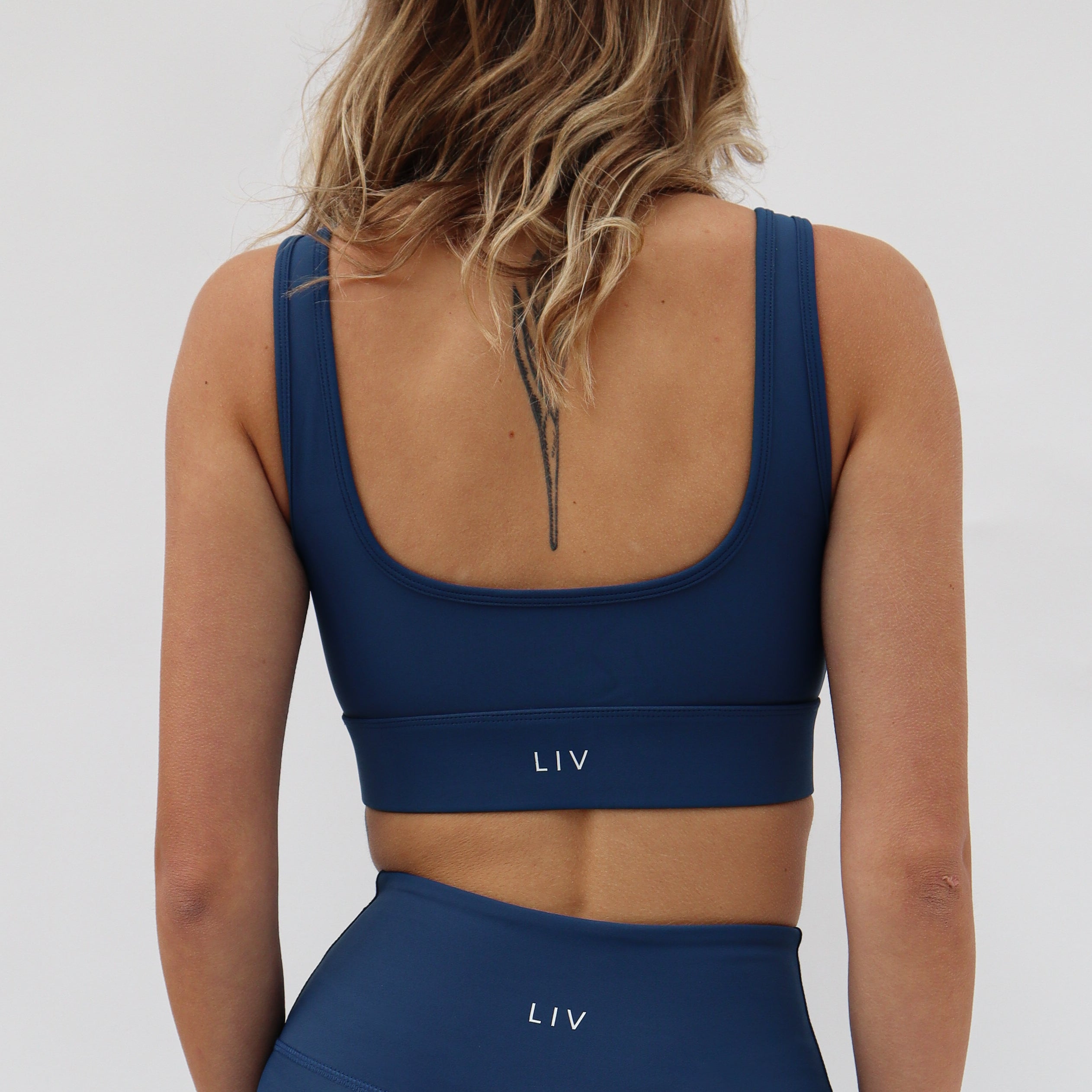 womens-dark-blue-sports-bra-3_9ac4119e-4cb9-4b23-8b6f-59c00b043e71.jpg